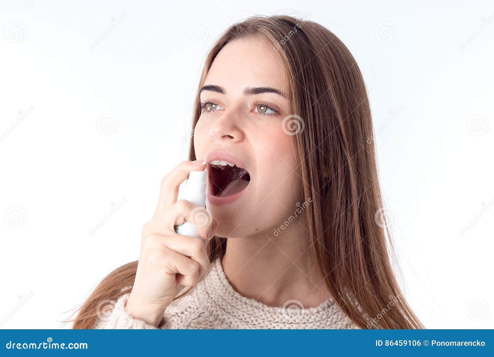 Young Girl Squirting Sore Throat Spray Is Isolated On A White