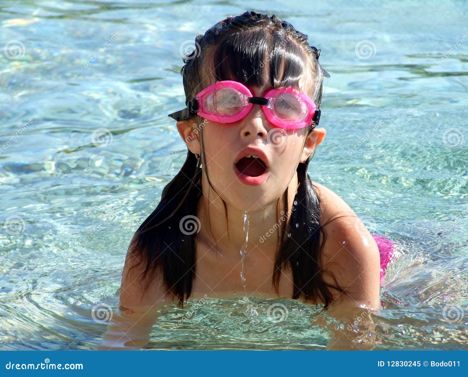 Young Girl Swimming in the Sea Stock Image - Image of dive, water: 12830245