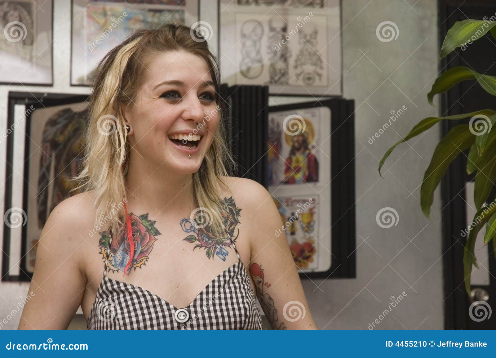 young girl in tattoo parlor