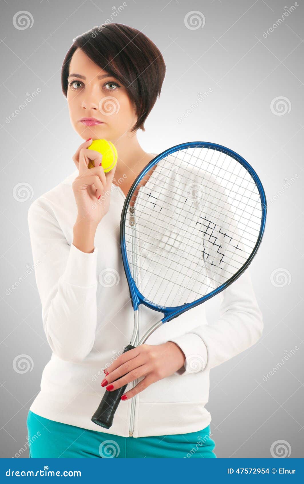 Young girl with tennis racket and bal on white