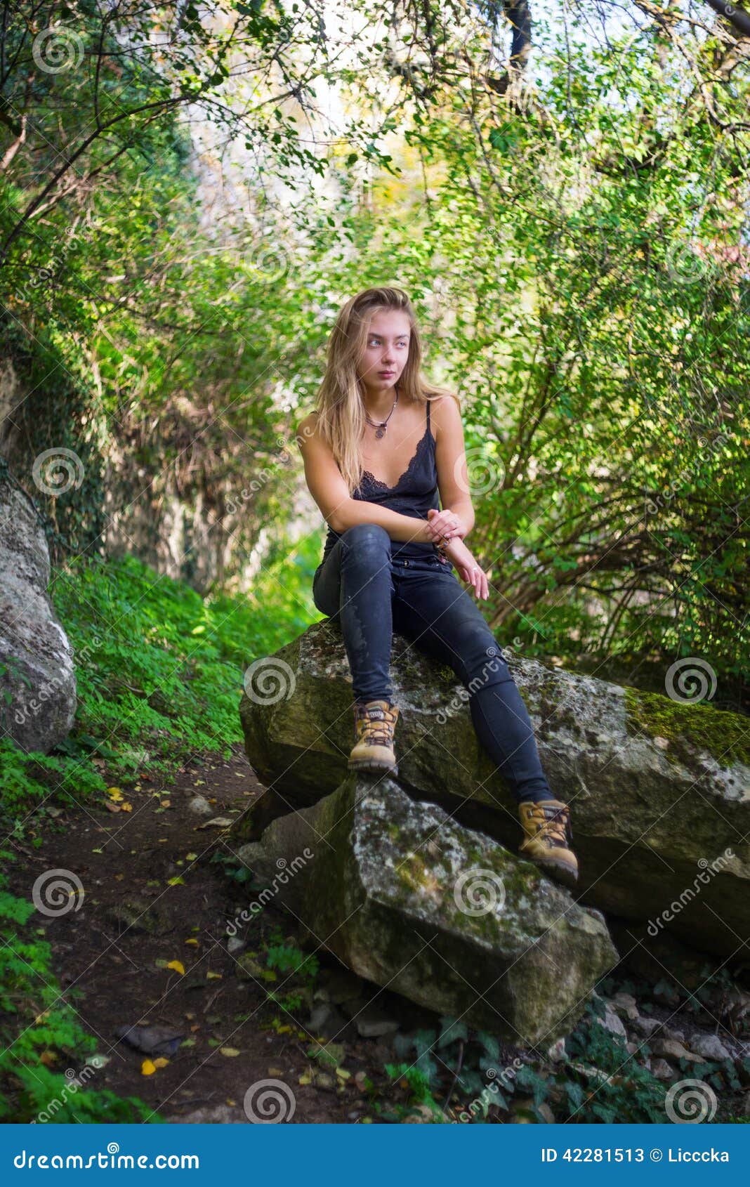 Thoughtfully Sitting In An Uninhibited Pose On A Shislong Girl Biting ...