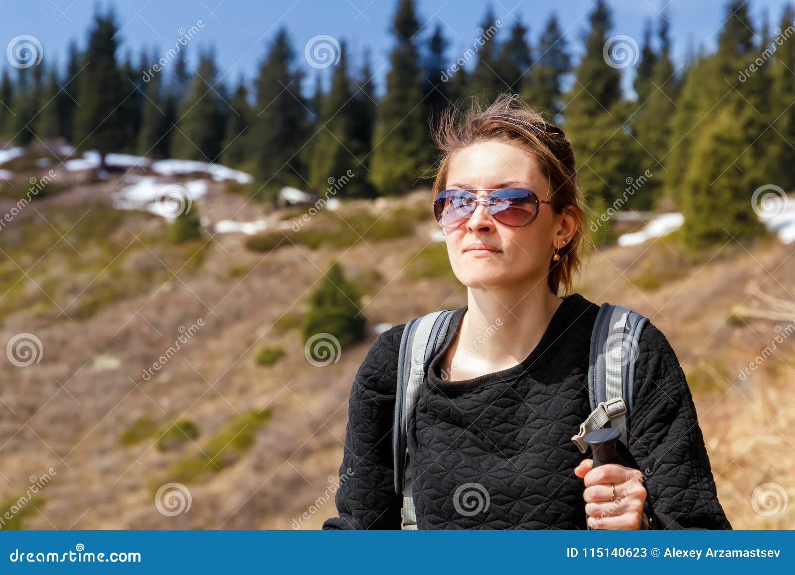 Young Girl with Trekking Sticks Walks Along the Mountain Trail Stock ...