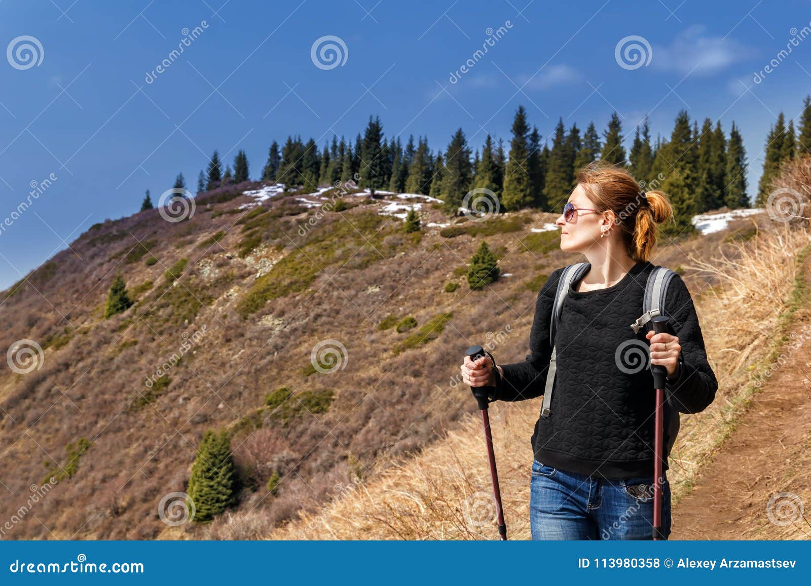 Young Girl with Trekking Sticks Walks in Mountains Stock Photo - Image ...