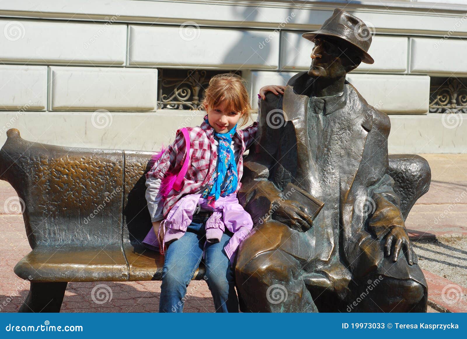 young girl on tuwim`s bench in lodz