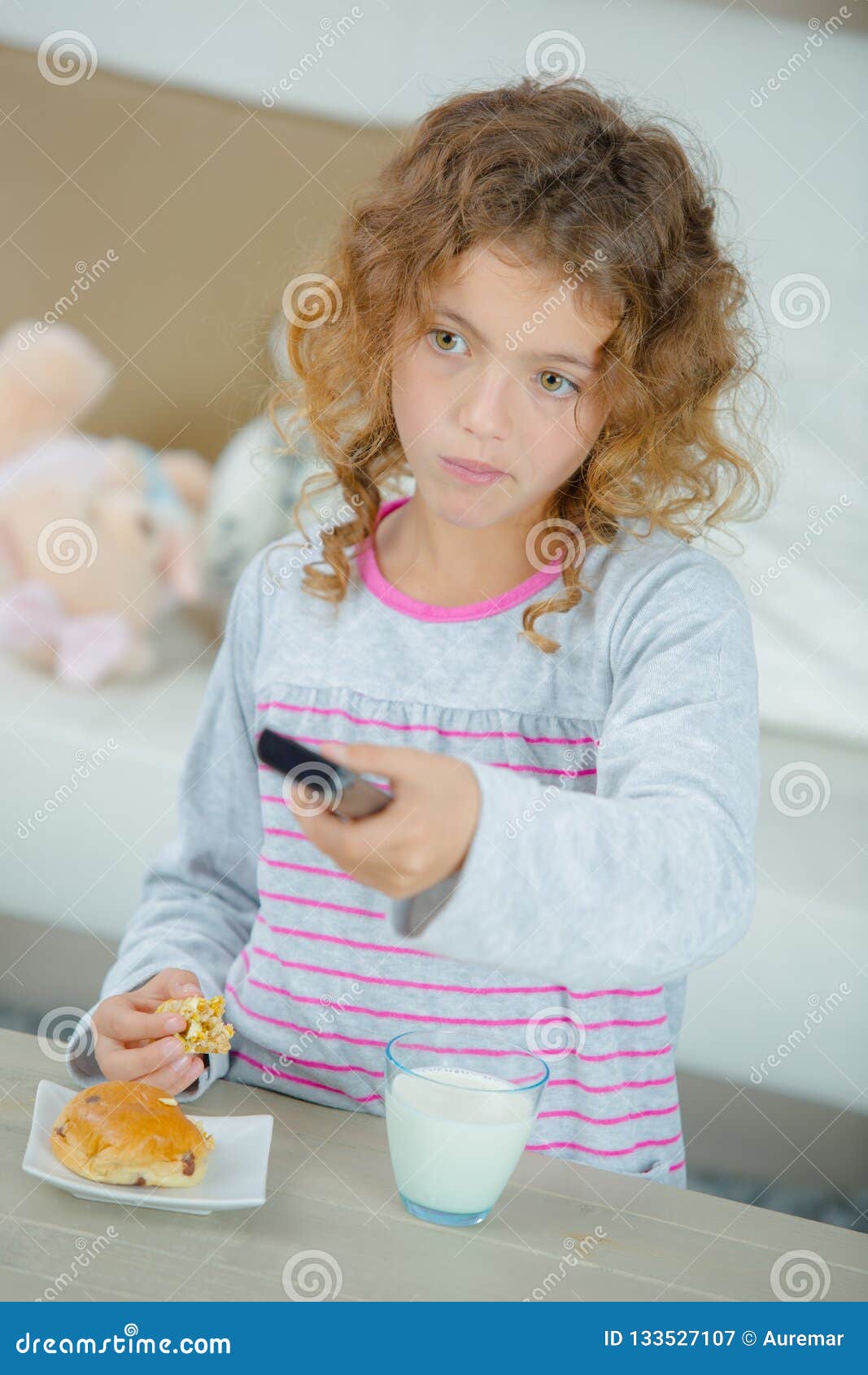 Young Girl Watching Tv while Eating Stock Image Image of snack