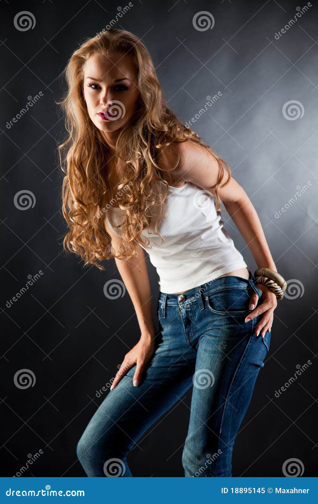 Young Girl In White T-shirt And Jeans Royalty Free Stock Photo - Image