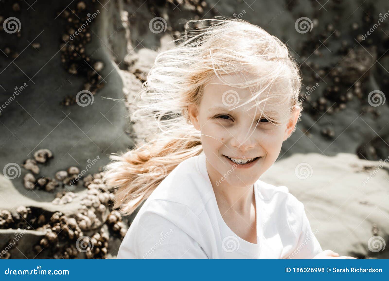 Young Girl with Wind Swept Blond Hair Stock Photo - Image of model ...