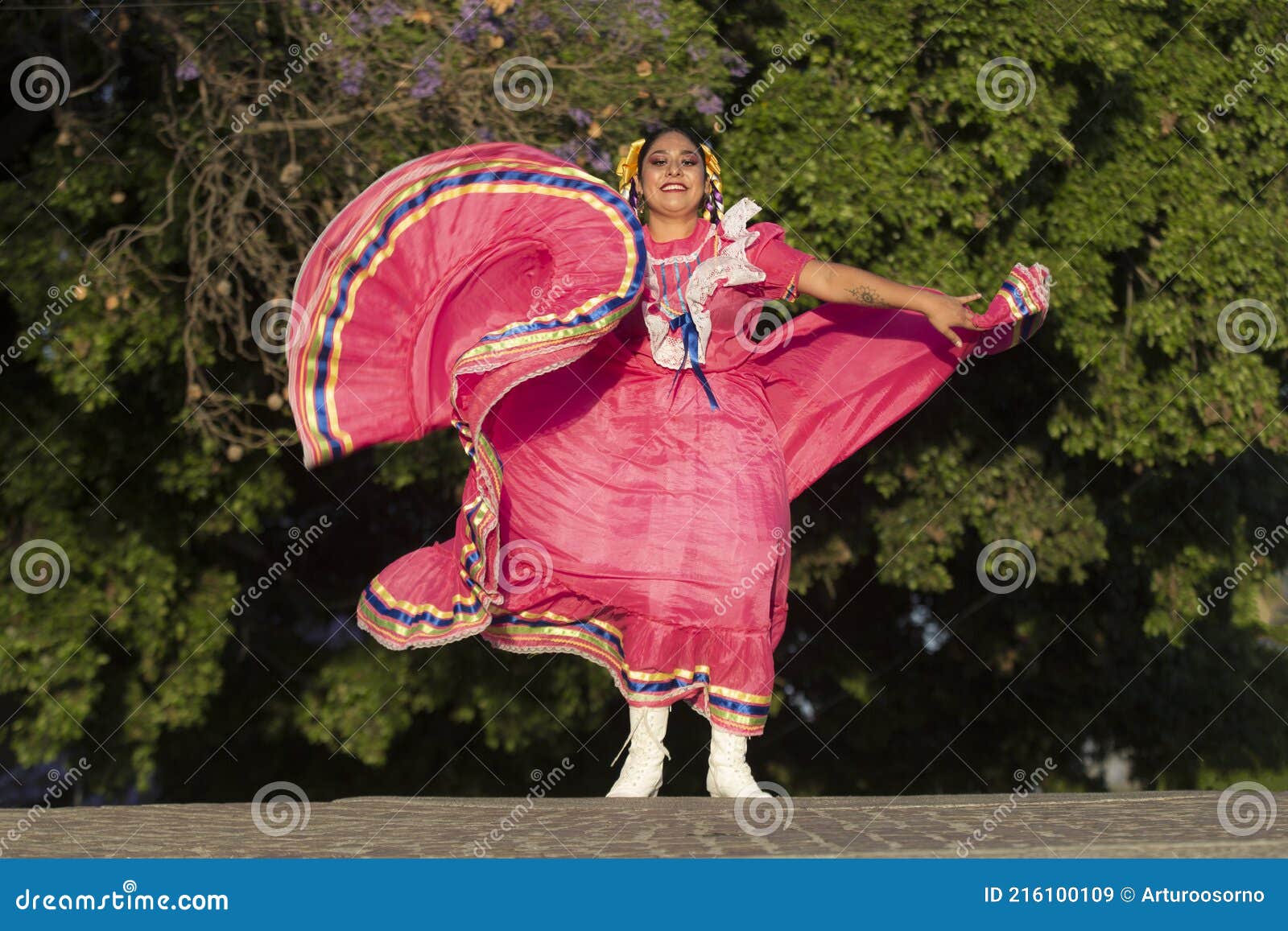 a mexican folk dancer wearing traditional costume