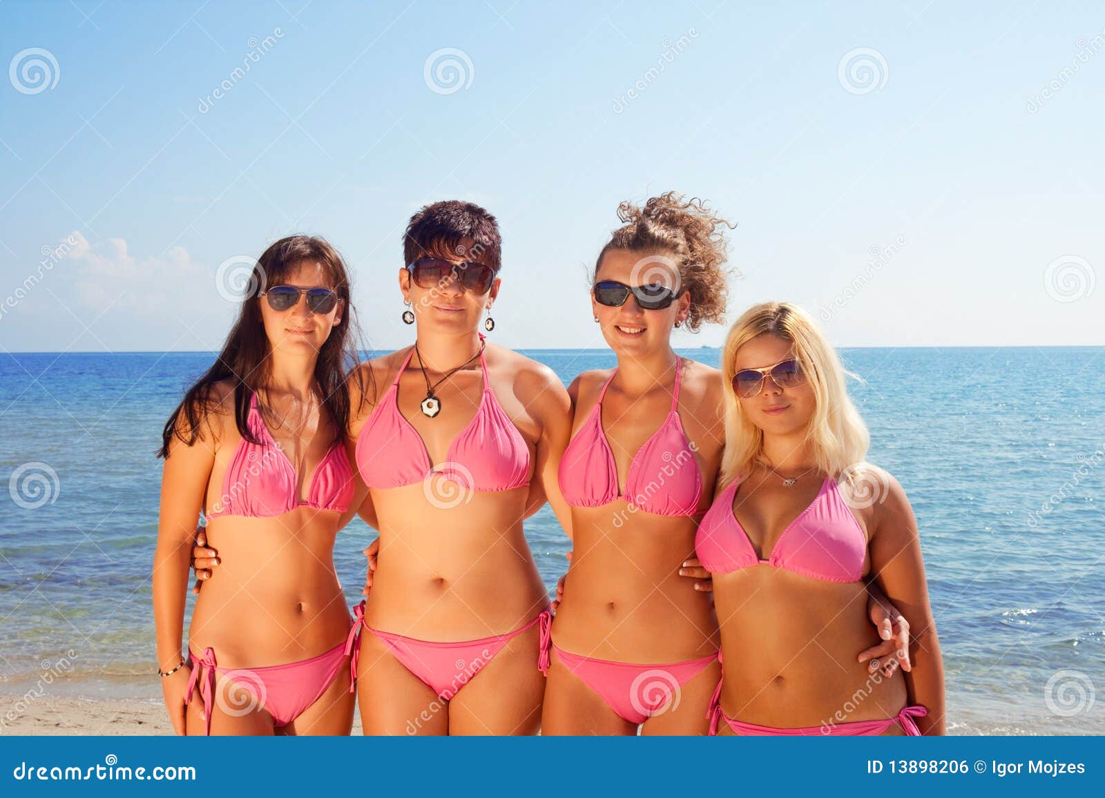 young girls in bikinis on beach