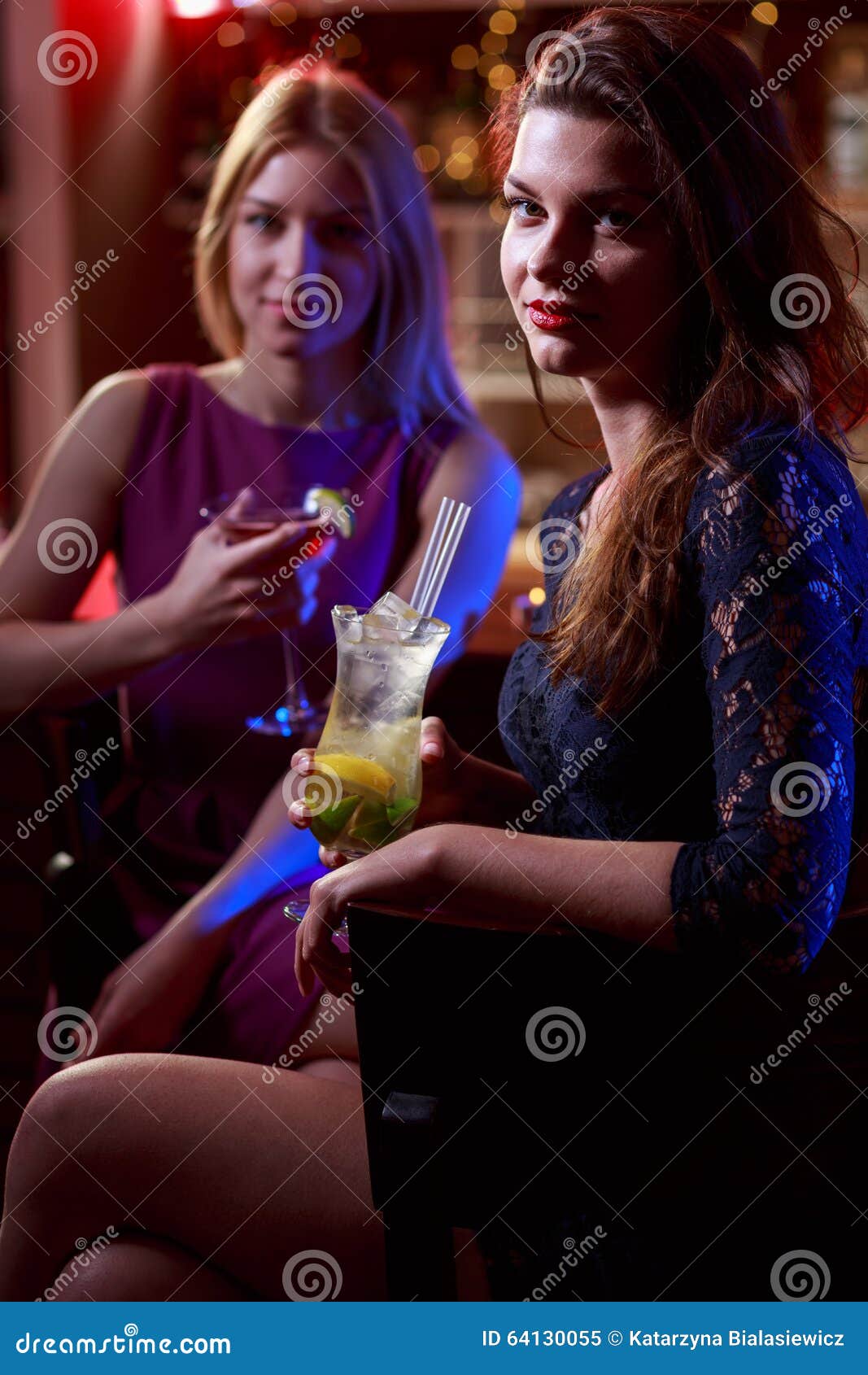 Young Girls Drinking in Stock Image Image of evening