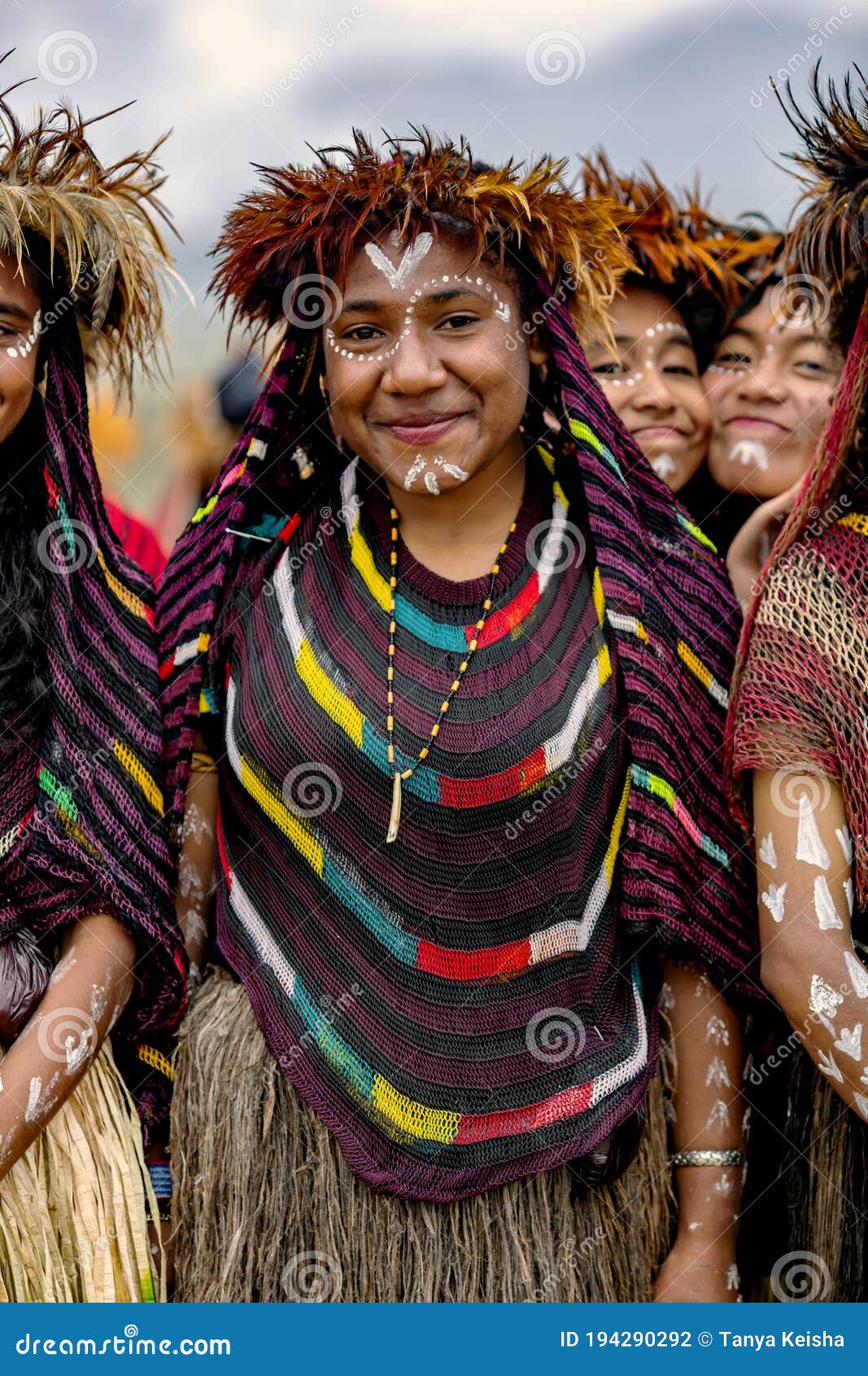 Young Girls  Of A Papuan Tribe In A Beautiful Crown From 