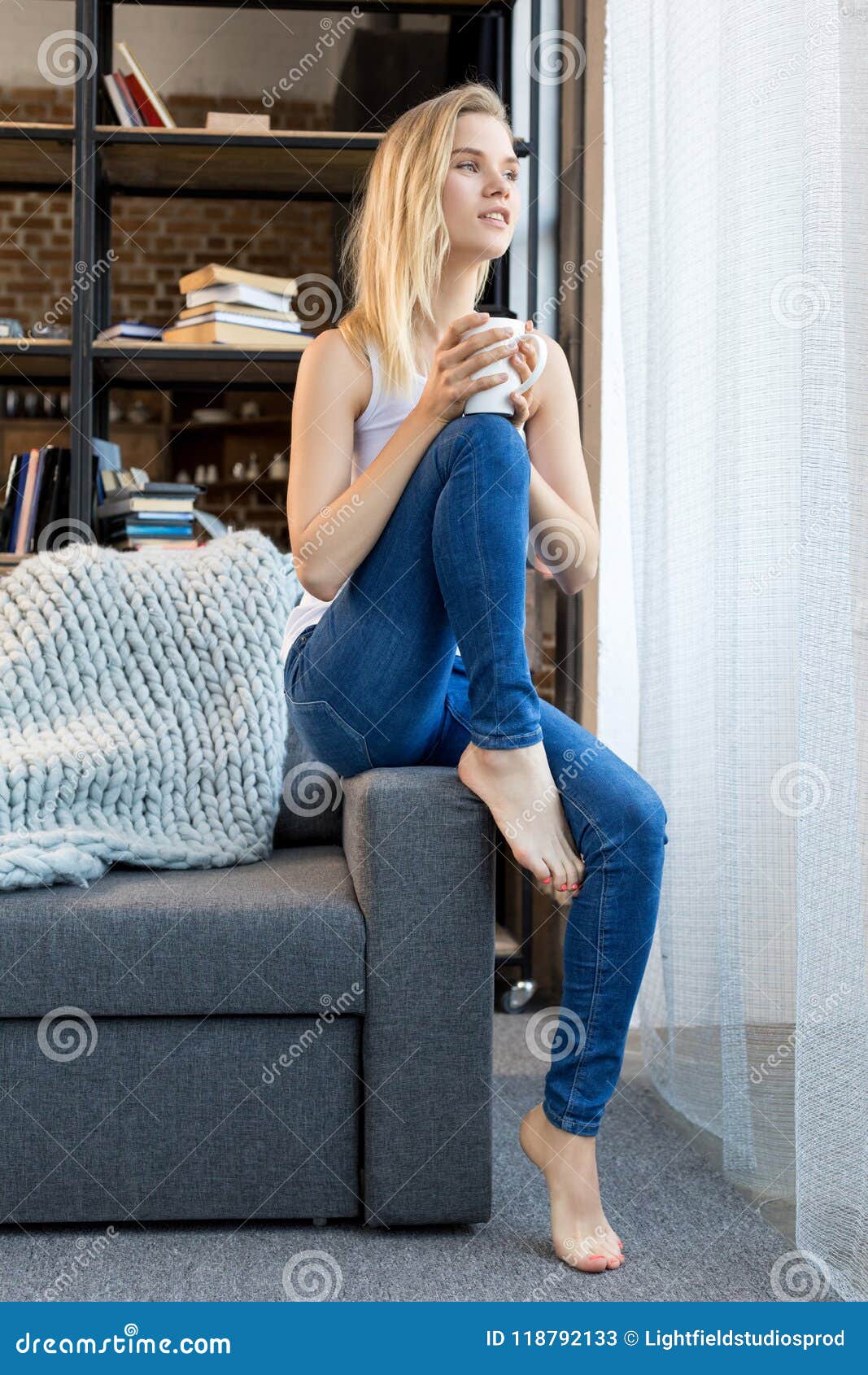 Young Gorgeous Blonde Woman with Coffee Near Window in Living Stock ...