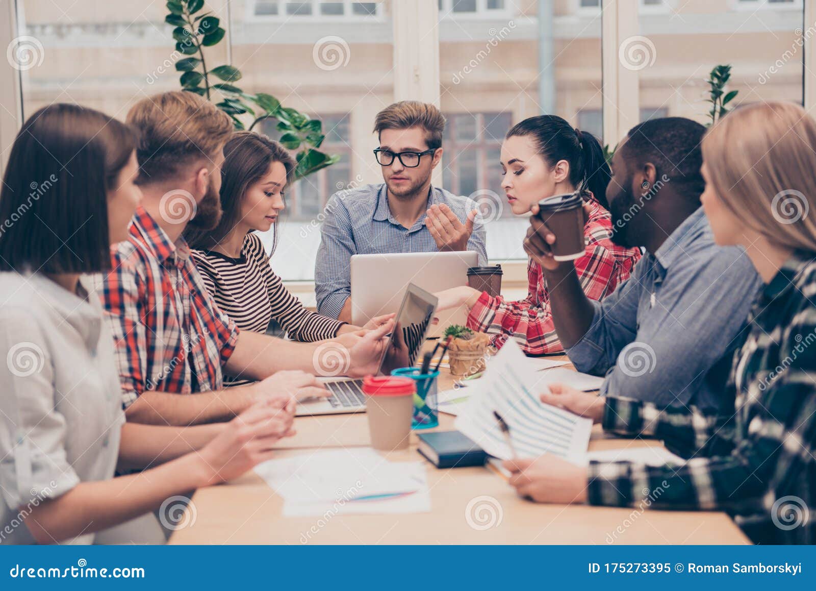 Young Group of Business People Discussing Business Plan Stock Image