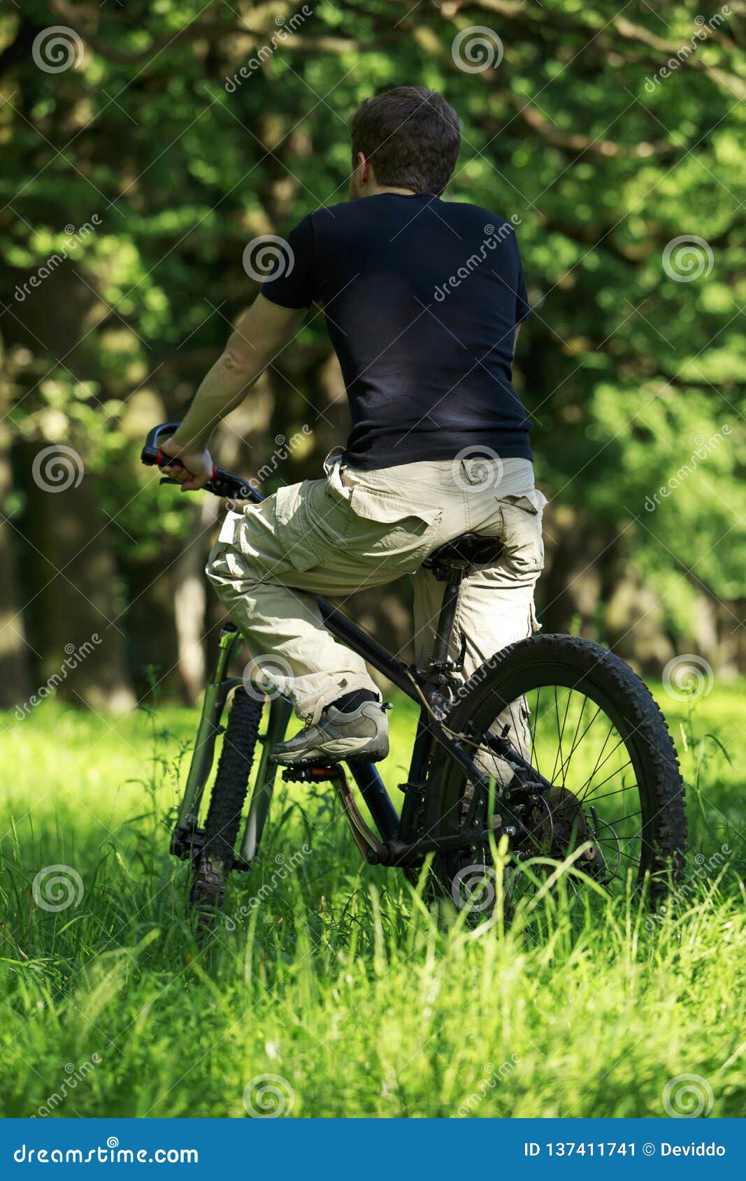 Young guy on bike stock image. Image of athlete, plant - Young Guy Bike Athlete Bicycle Oak Park 137411741