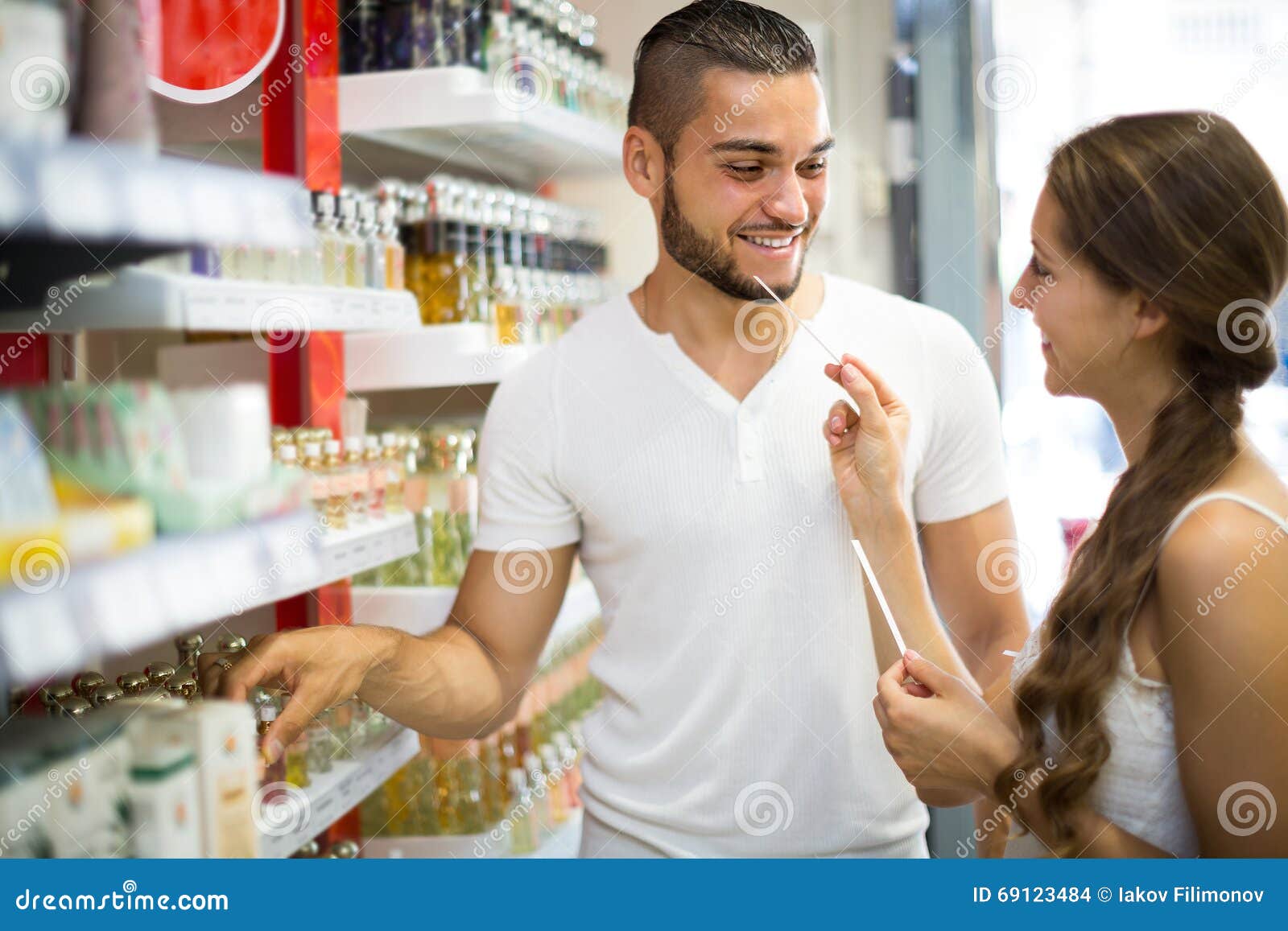 Young Guy Choosing Perfume in the Shop Stock Photo Image of
