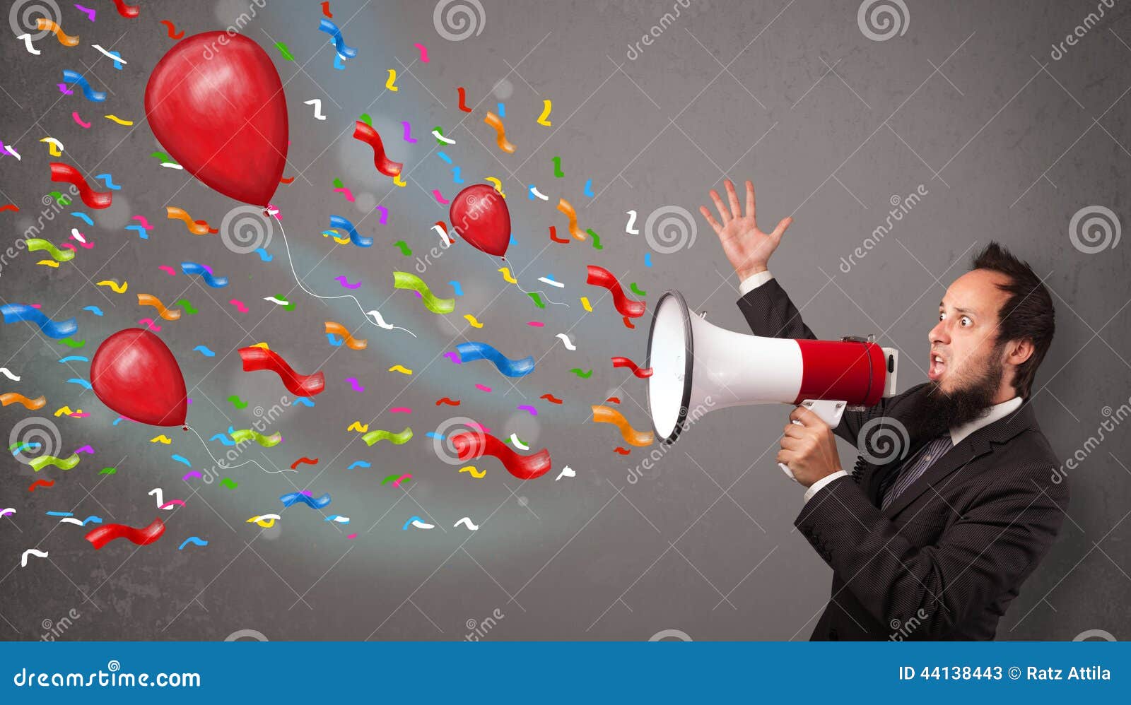 Young Guy Having Fun, Shouting into Megaphone with Balloons Stock Image