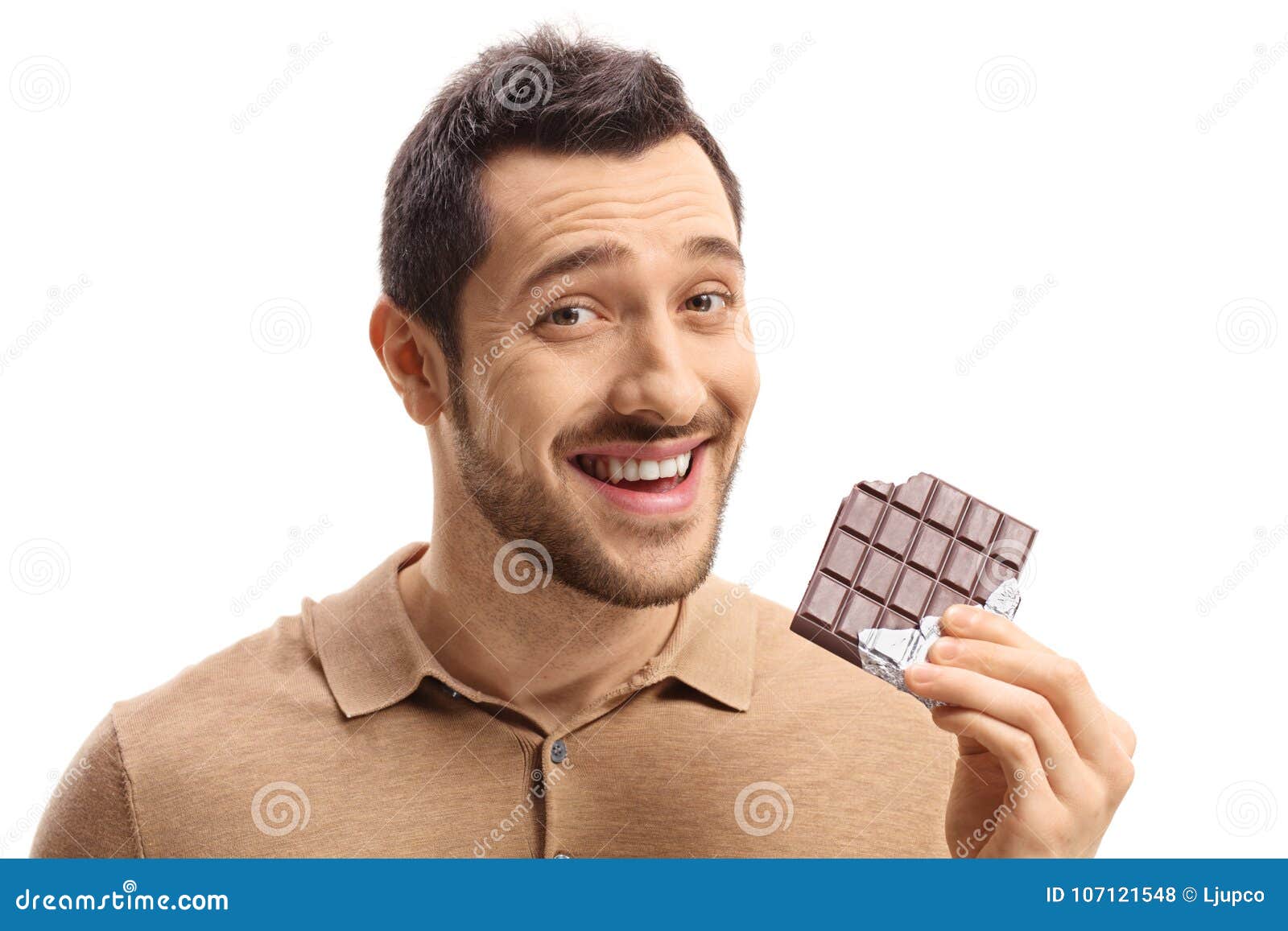 Young Guy Holding a Bitten Chocolate Bar and Smiling Stock Photo ...