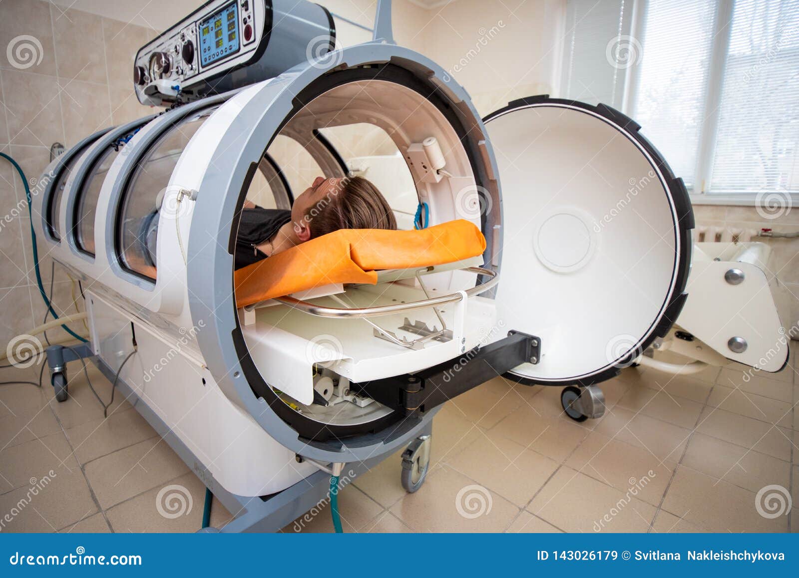 young guy in a hyperbaric chamber, oxygen treatment