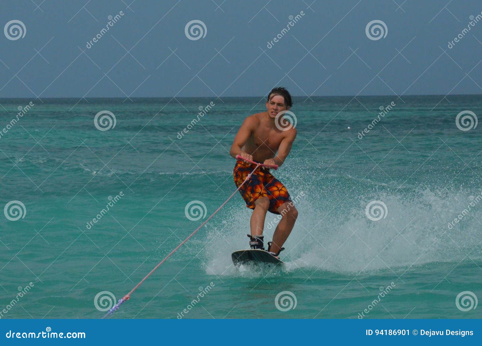 Young Guy Making a Funny Face while Wakeboarding Stock Image Image of