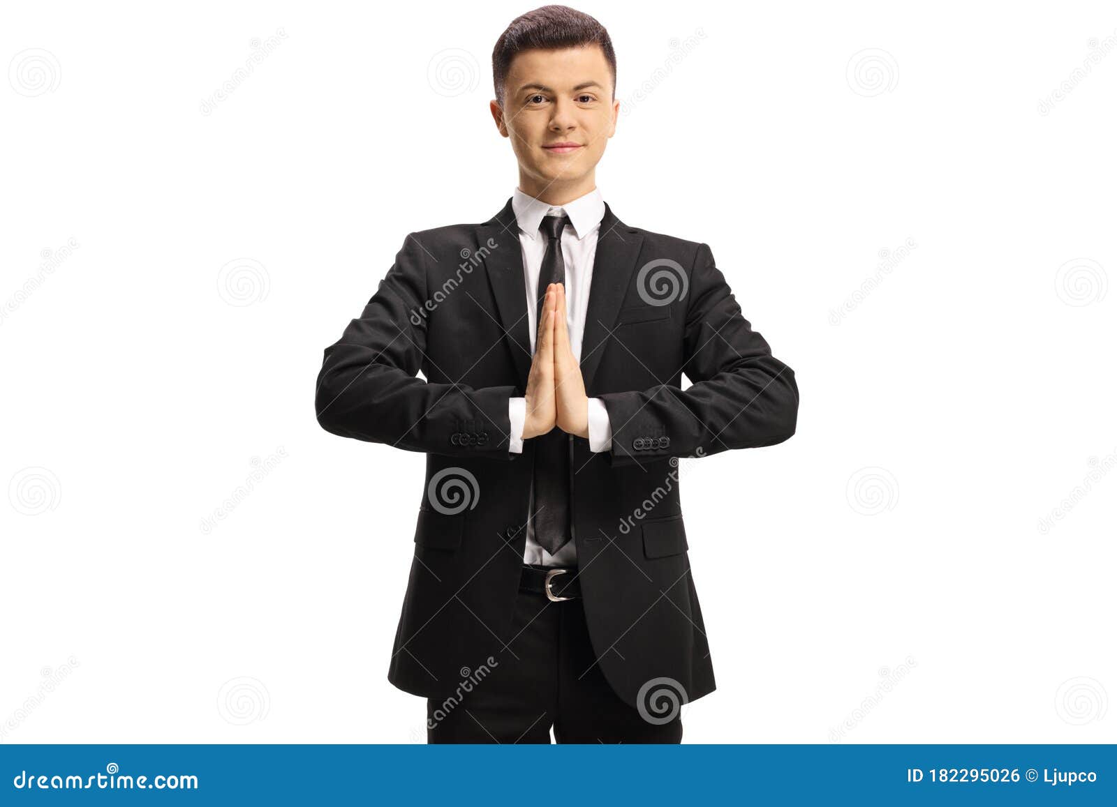 Young Guy in a Suit and Tie Practicing Meditation and Smiling Stock ...