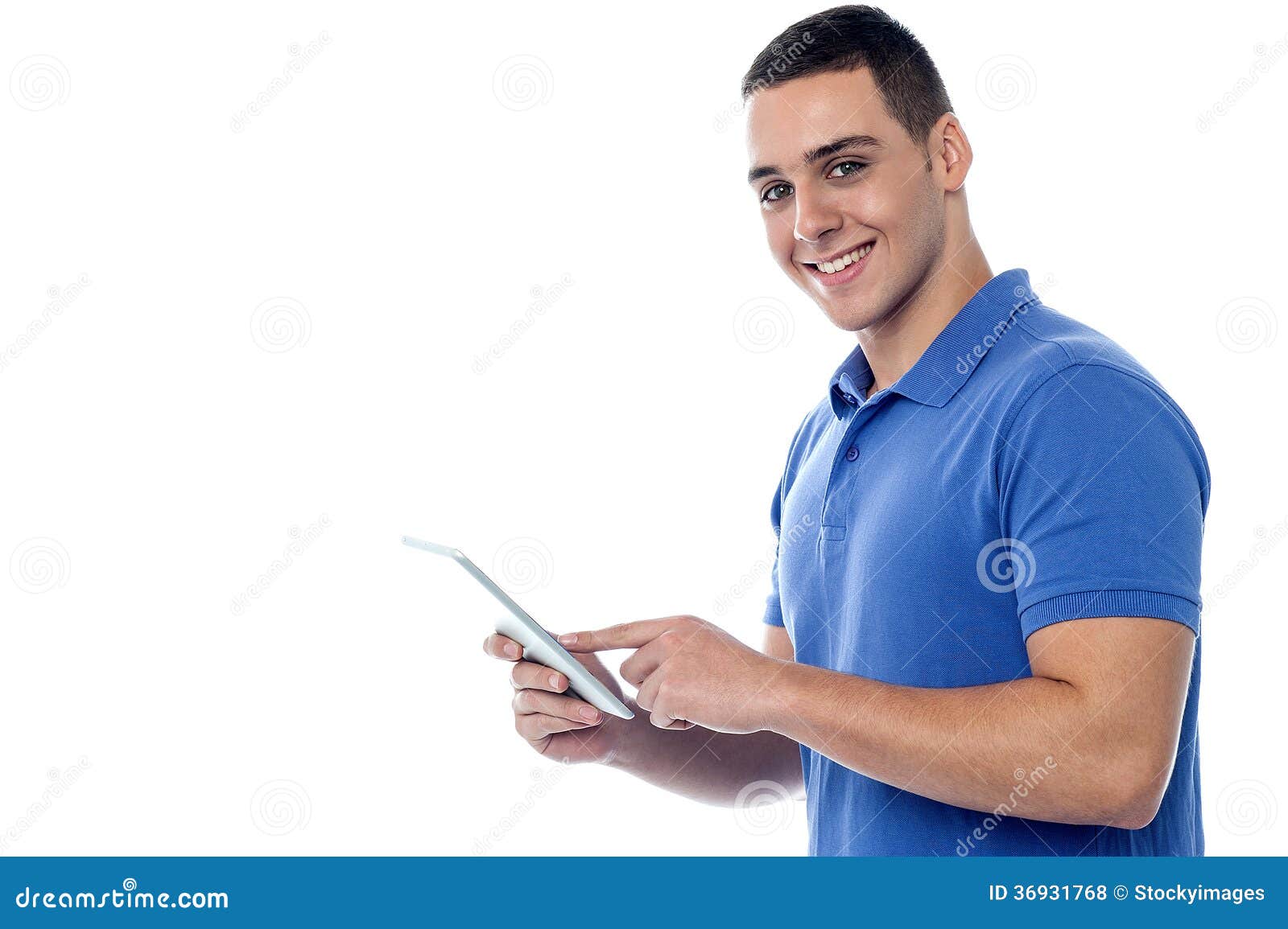 Young guy using tablet pc stock photo. Image of smiling 36931768