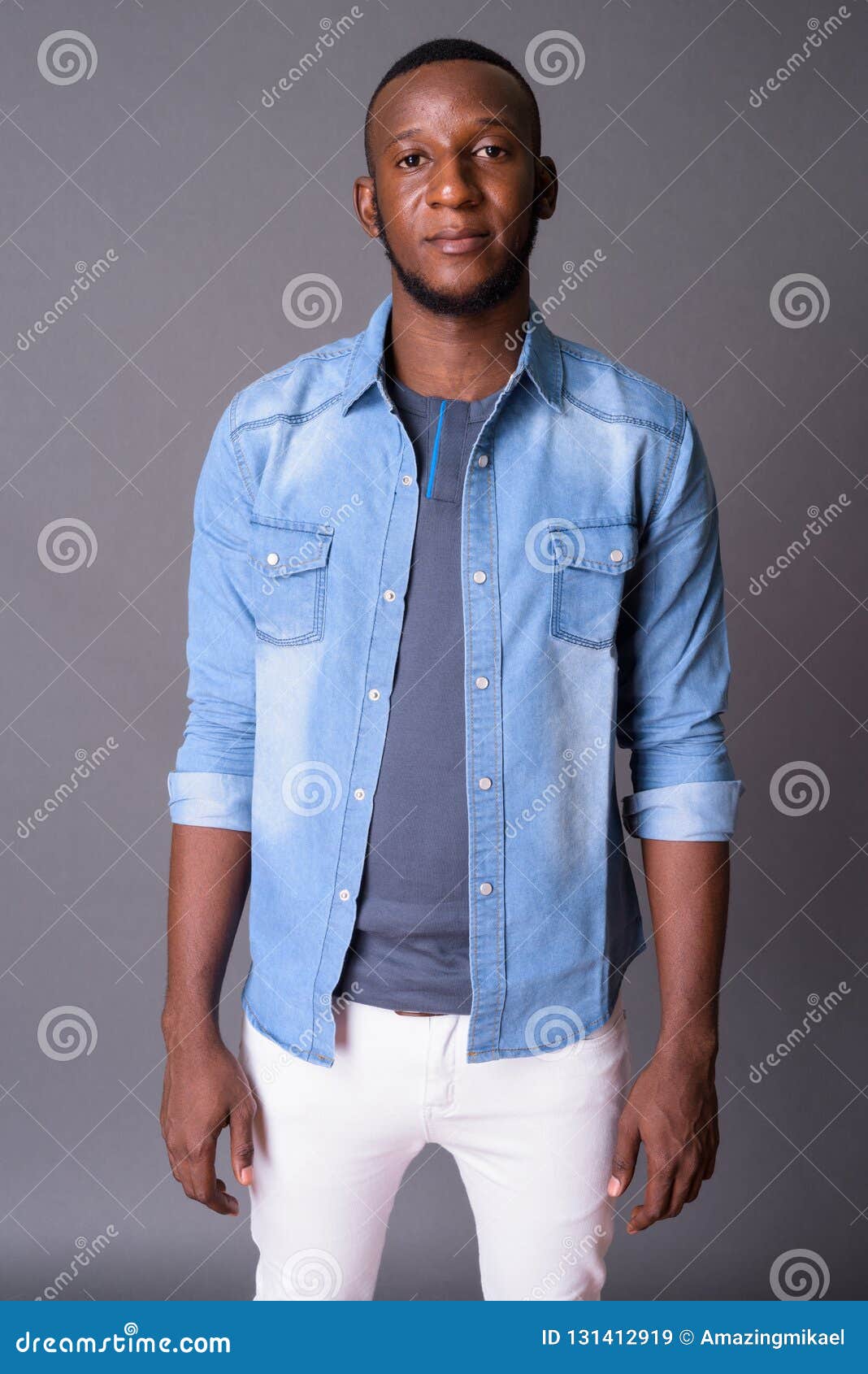 Young Handsome African Man with Short Hair Against Gray Backgrou Stock ...