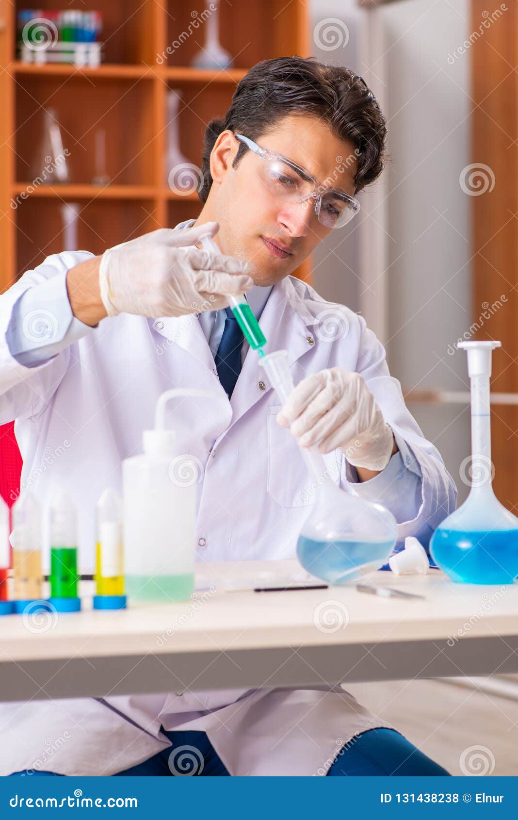 the young handsome biochemist working in the lab