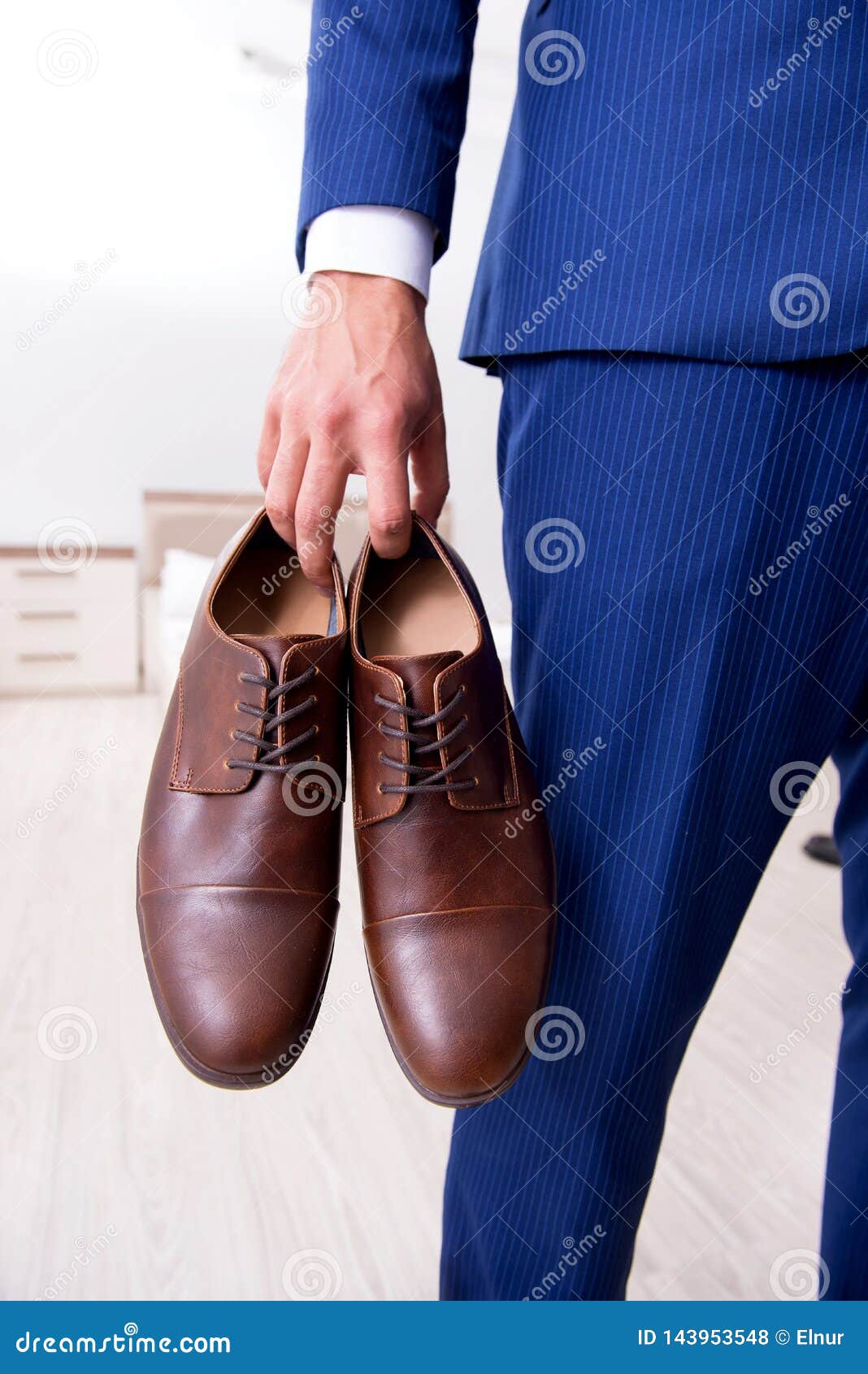 The Young Handsome Businessman Choosing Shoes at Home Stock Photo ...