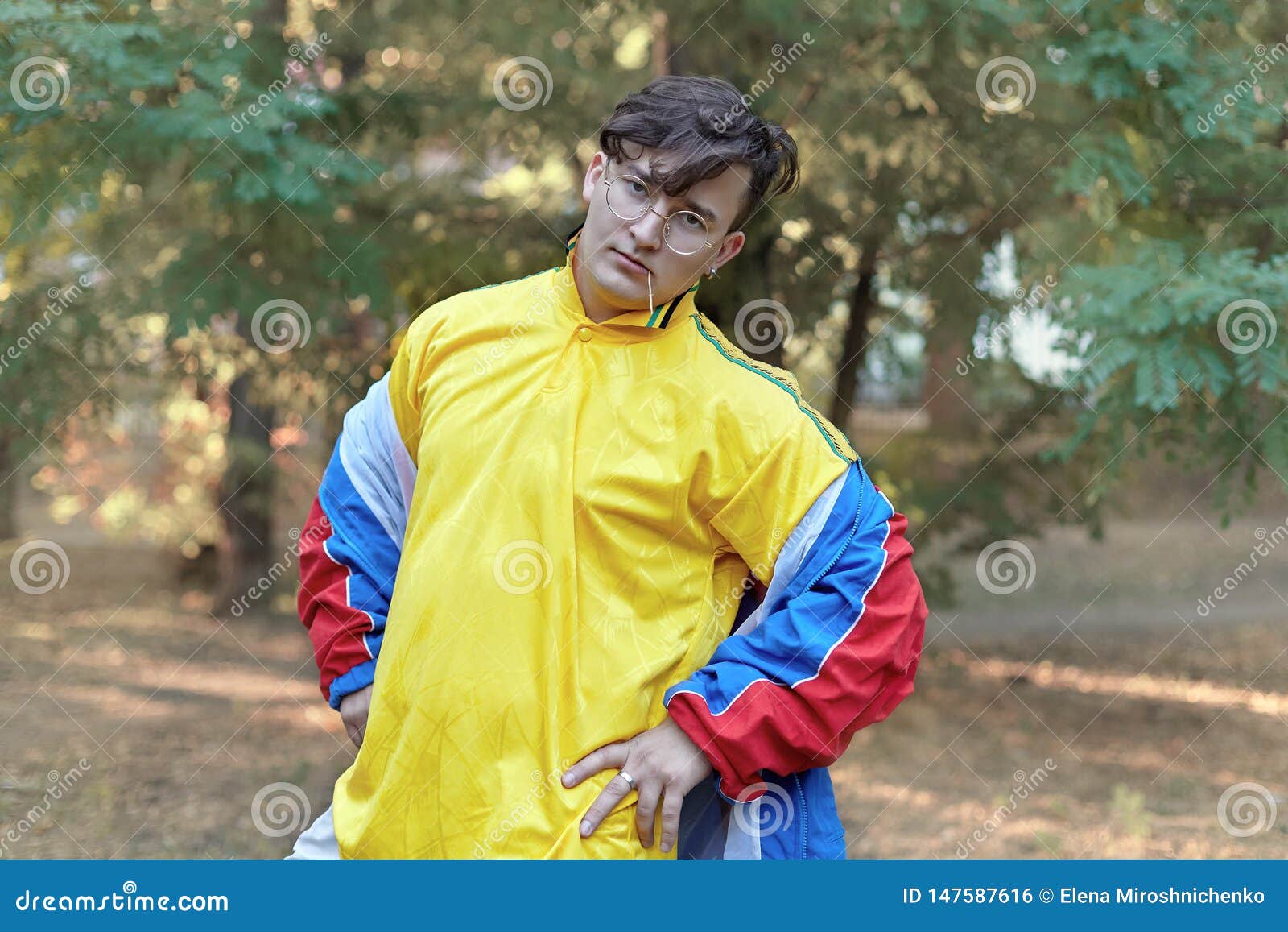 Young Handsome Caucasian Man with Bright Freaky Sportswear 70s