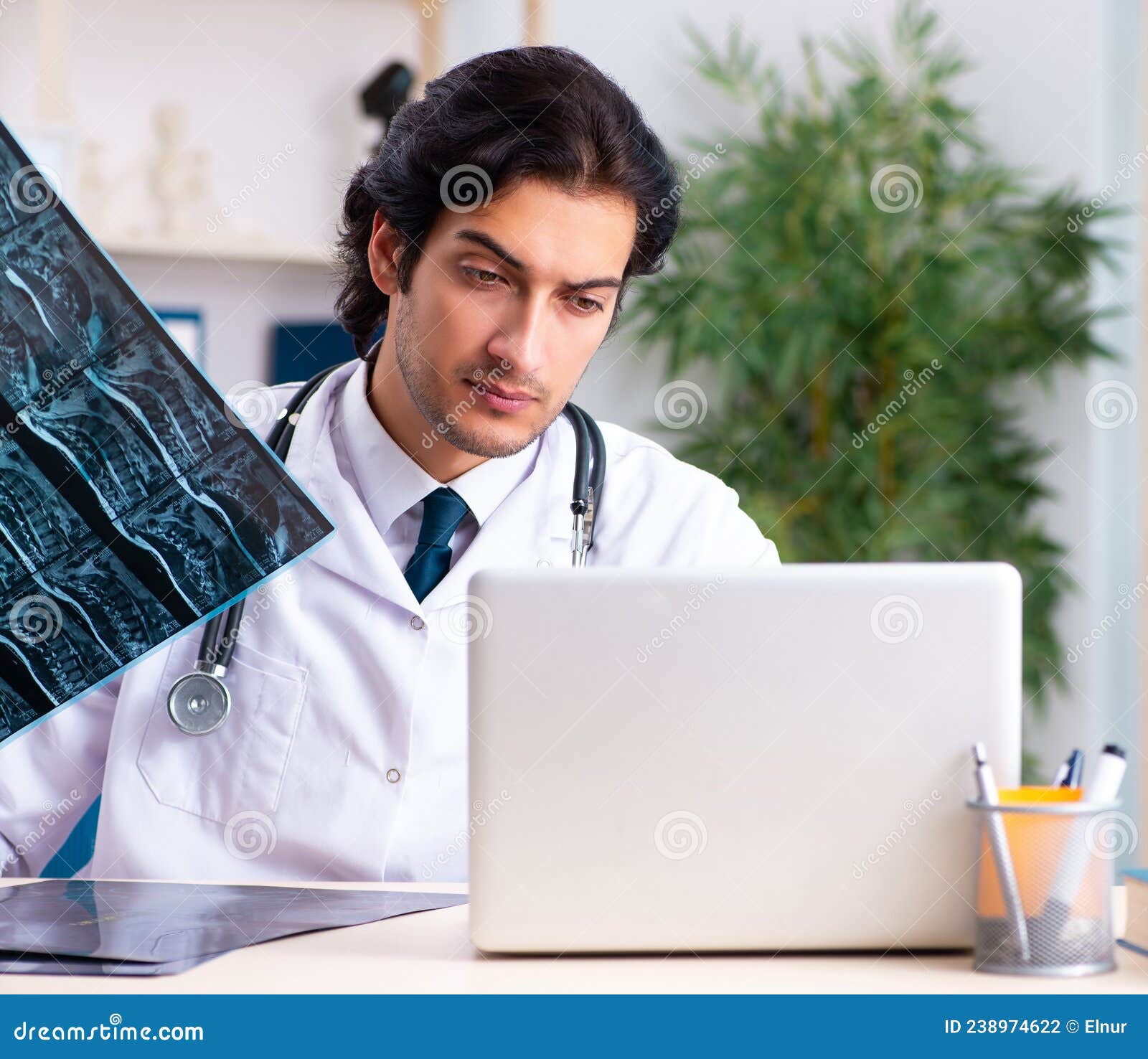 The Young Handsome Doctor Radiologist Working in the Clinic Stock Photo