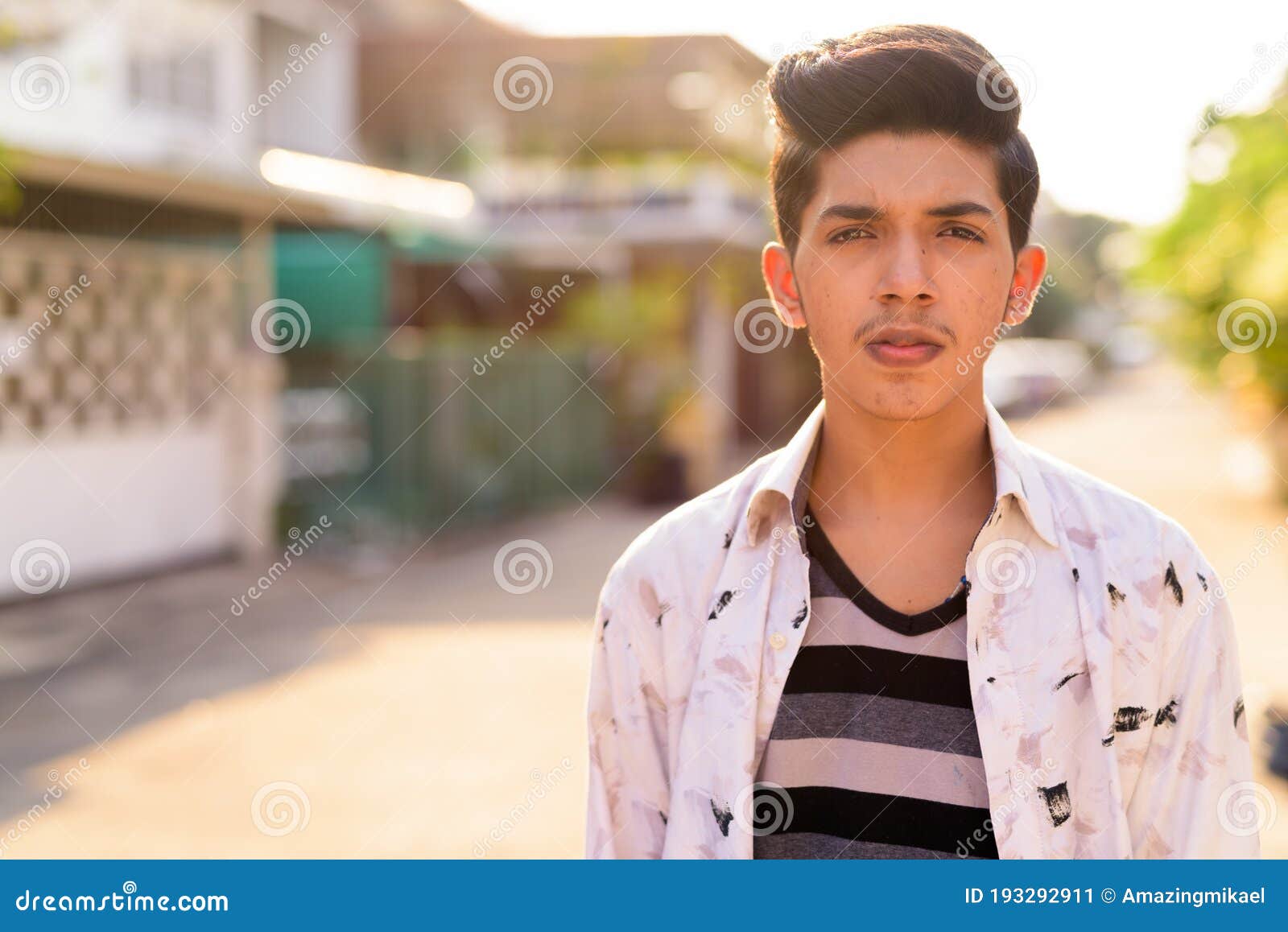 Profile of a Teenage Indian Boy Looking at outsides Stock Photo