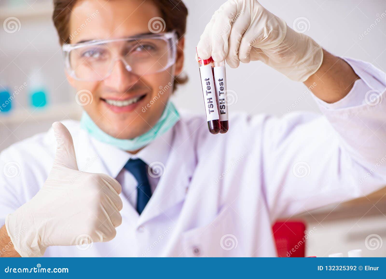 The Young Handsome Lab Assistant Testing Blood Samples in Hospital