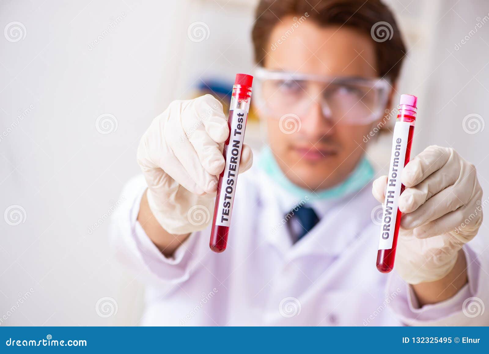 The Young Handsome Lab Assistant Testing Blood Samples in Hospital