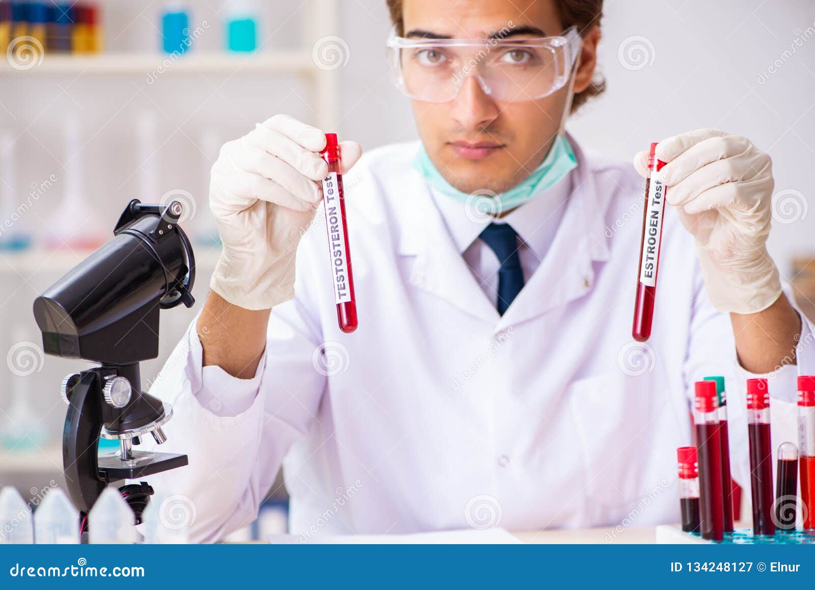 The Young Handsome Lab Assistant Testing Blood Samples in Hospital