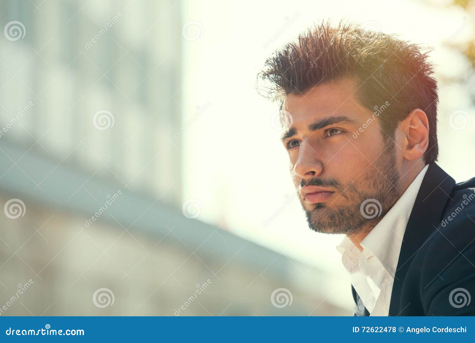 young handsome man bearded. hairstyle outdoors. hope attitude