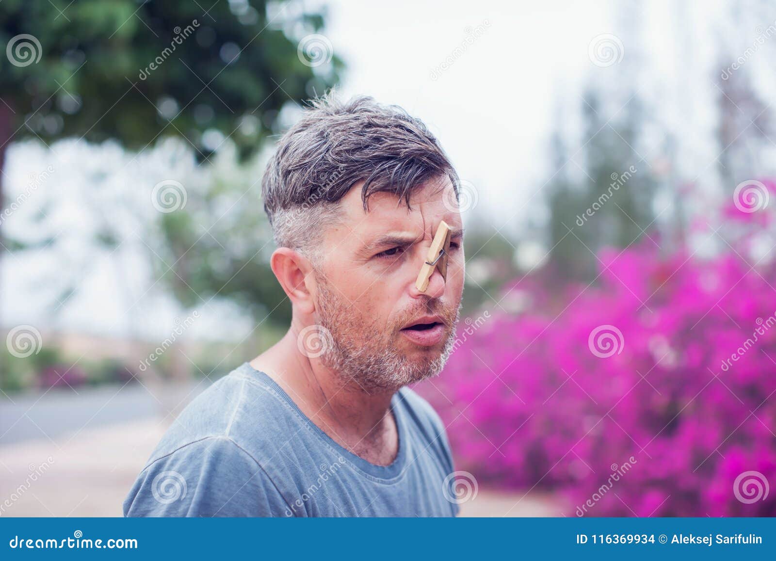 Young Handsome Man with Clothespin on His Nose. Allergy Stock Photo ...