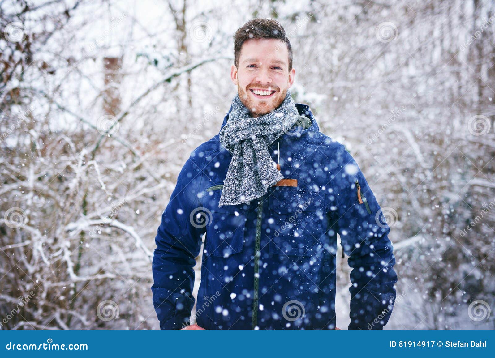 Young Handsome Man in Snowfall Smiling Cheerfully Stock Image - Image ...