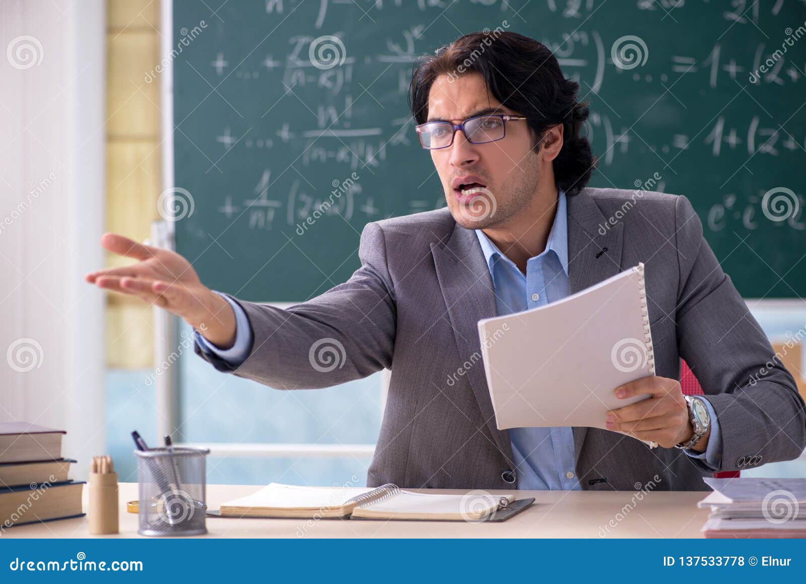 The Young Handsome Math Teacher In Classroom Stock Photo Image Of