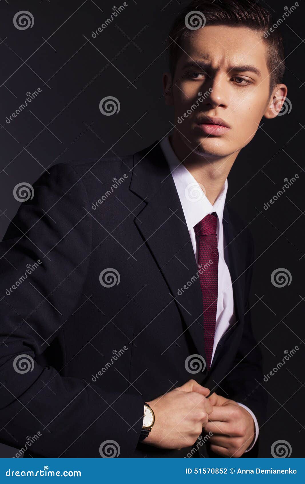 Profile View Of Older Man In Black Suit And Red Tie With Hand On Hat Stock  Photo, Picture and Royalty Free Image. Image 68600378.