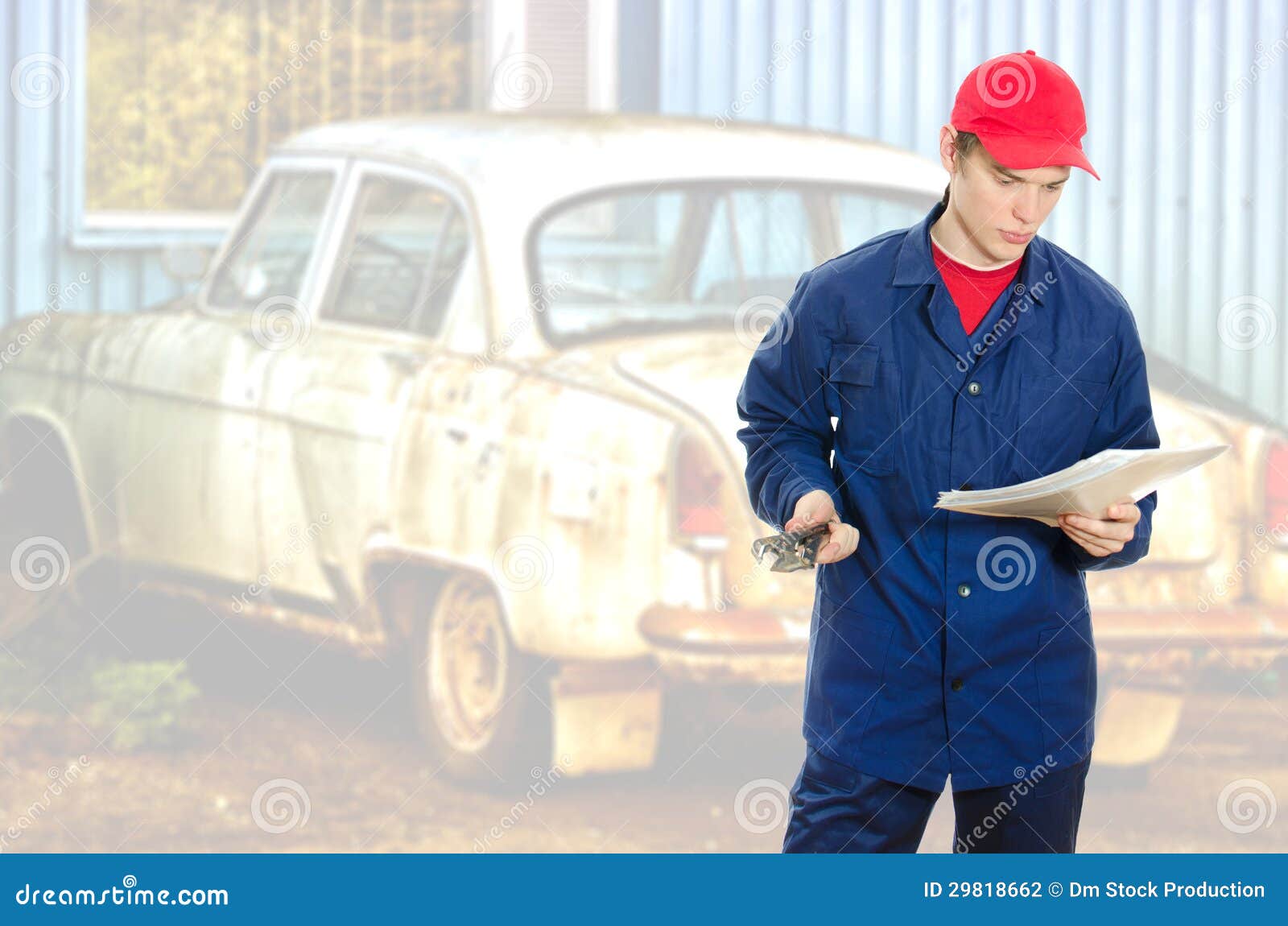 Mechanic reading manual stock photo. Image of male, install 29818662