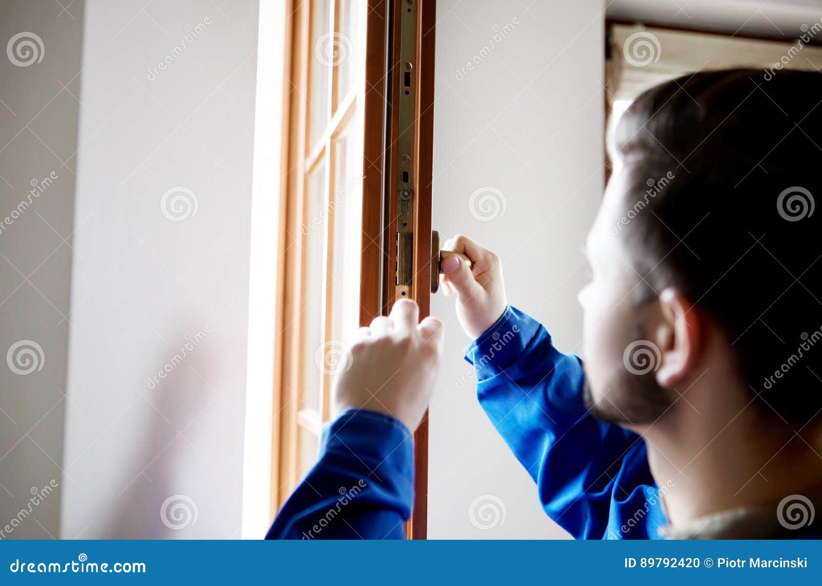 Young Handyman Repair Window with Screwdriver Stock Photo Image of