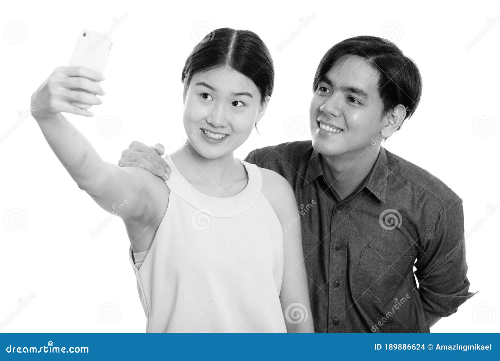 Young Happy Asian Couple Smiling While Taking Selfie Picture With 