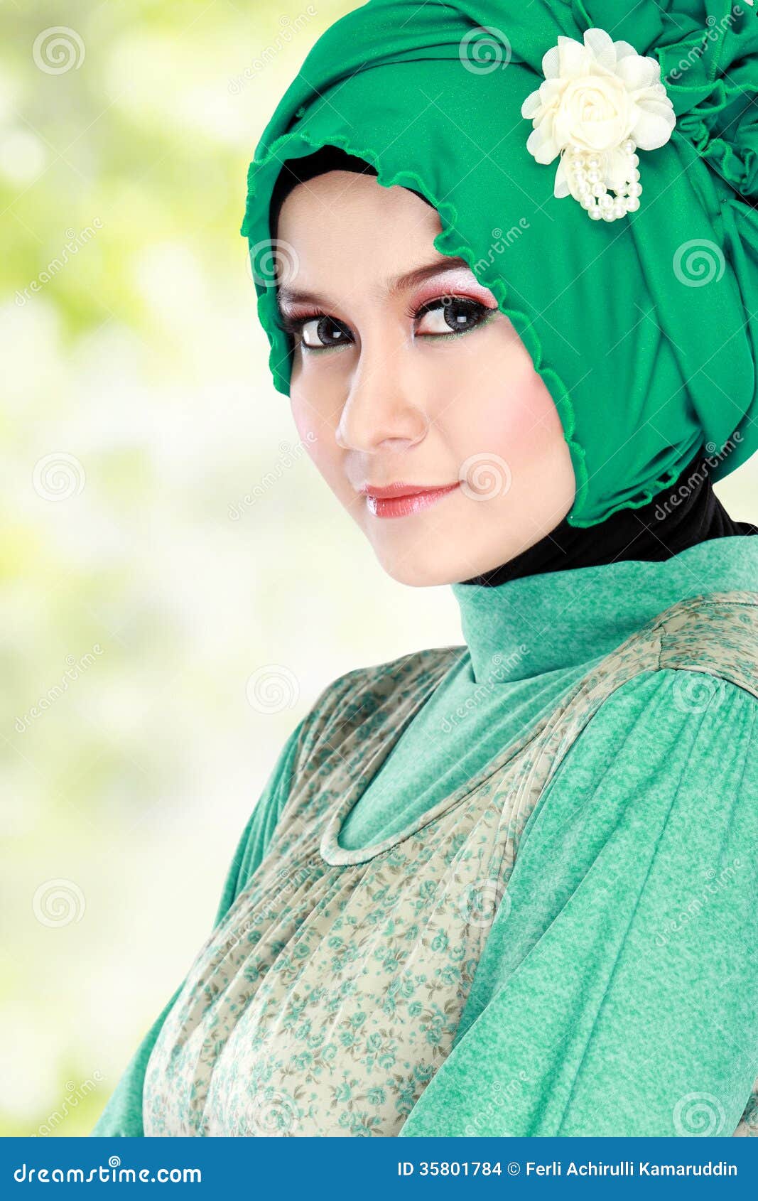 Young Happy Beautiful Muslim Woman With Green Costume 