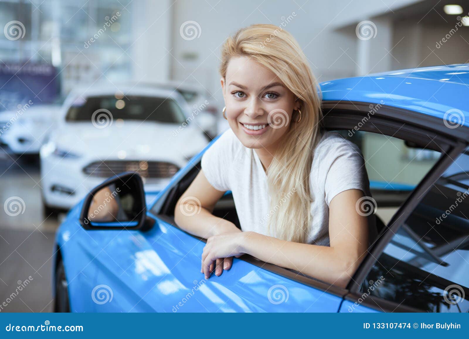 Beautiful Young Woman Buying New Car at the Dealership Stock Photo ...