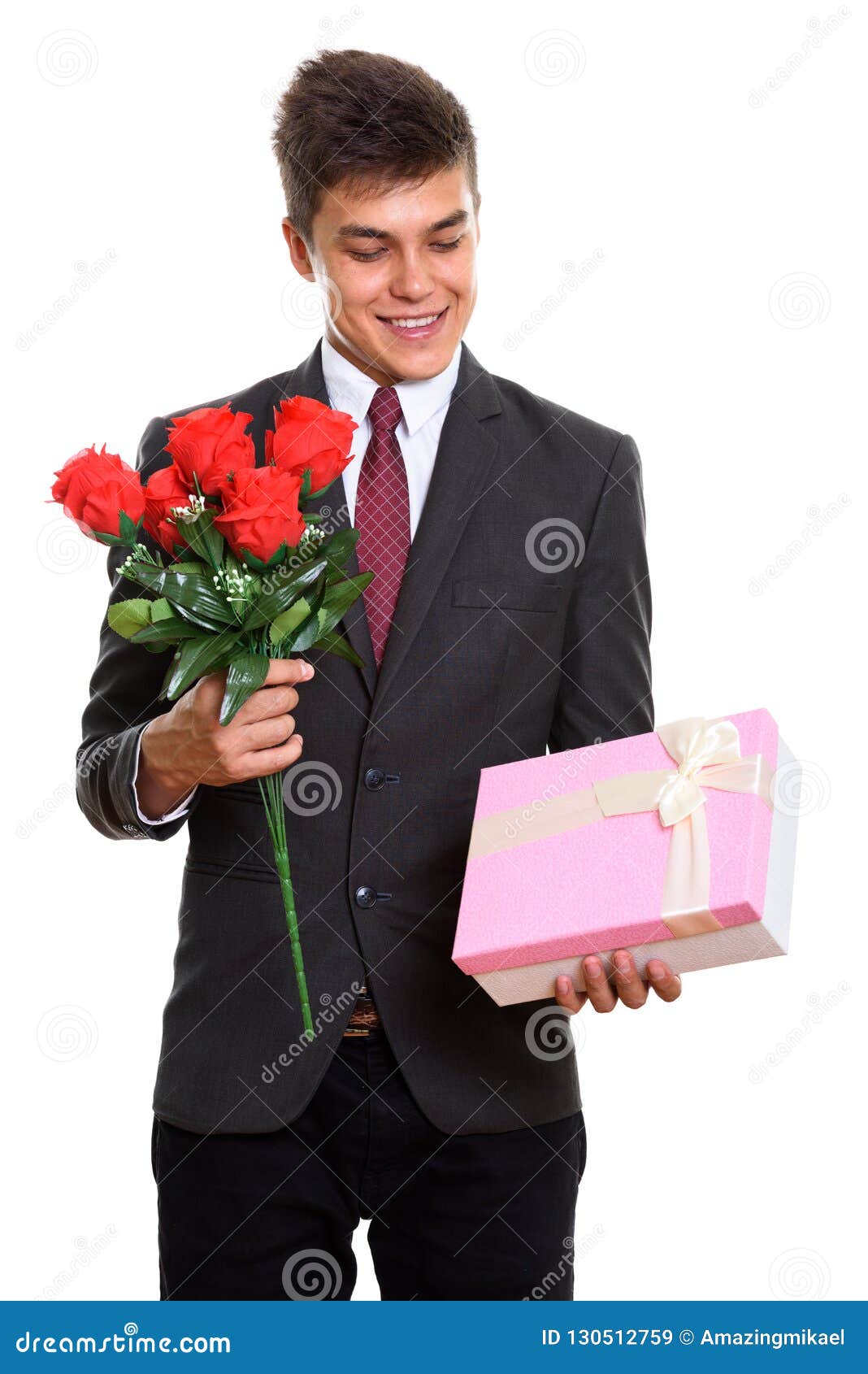 Young Happy Businessman Smiling while Holding Red Roses and Look Stock ...