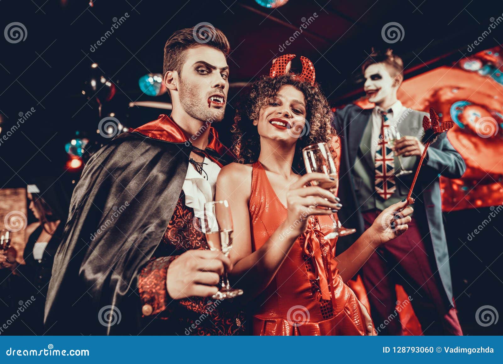 Premium Photo  Adults wearing halloween costumes in nightclub