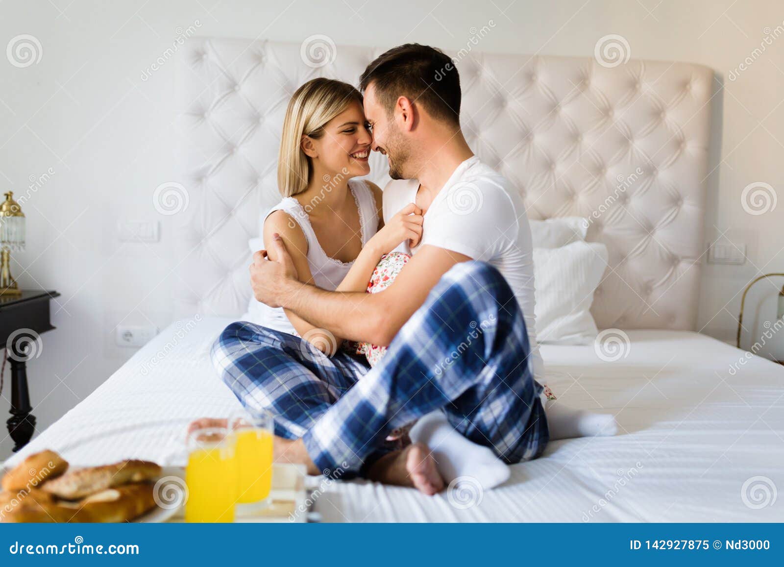 Young Couple Having Having Romantic Times In Bedroom Stock Image