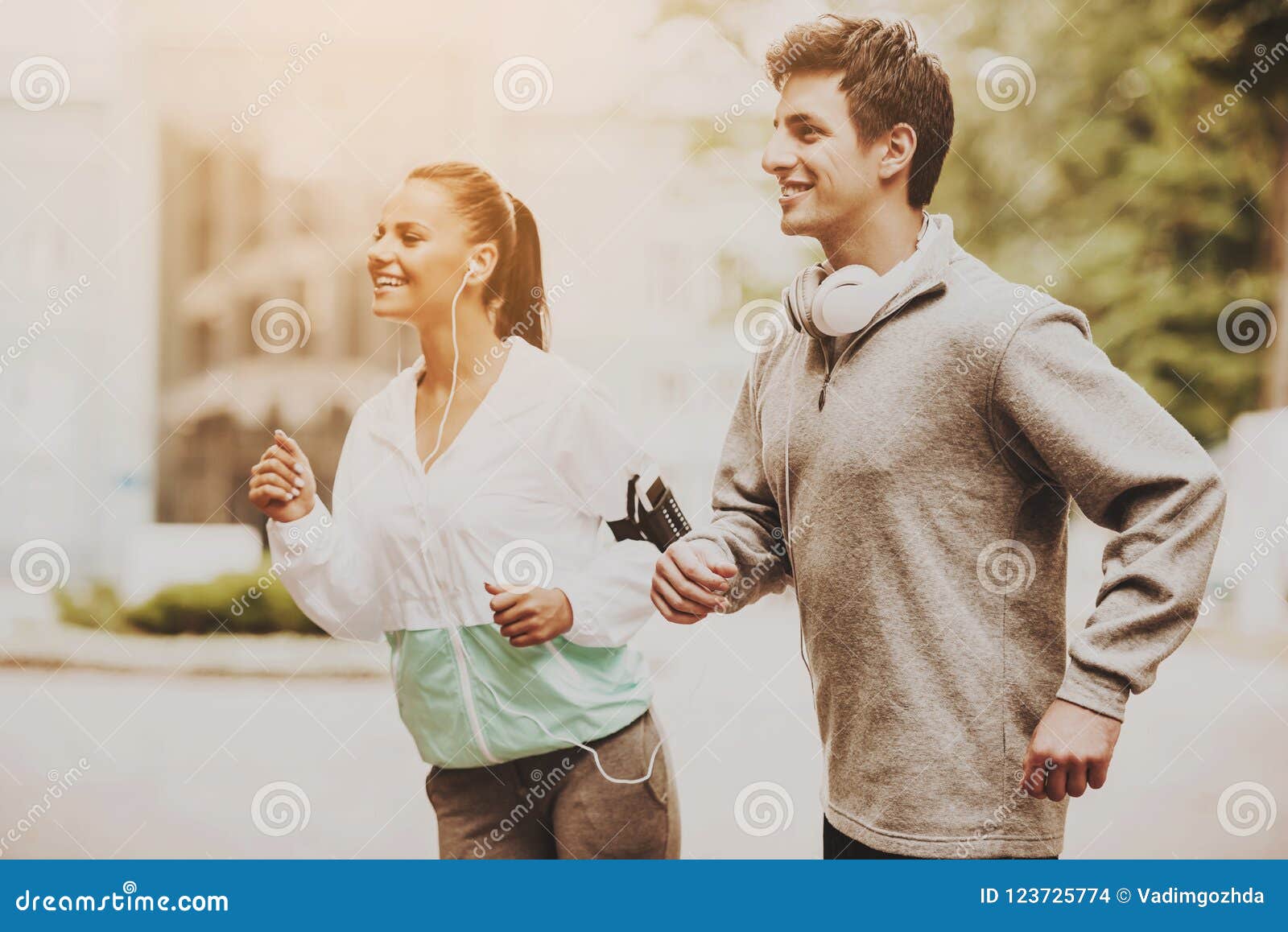 Young Happy Couple during Jogging in Morning. Stock Photo - Image of ...