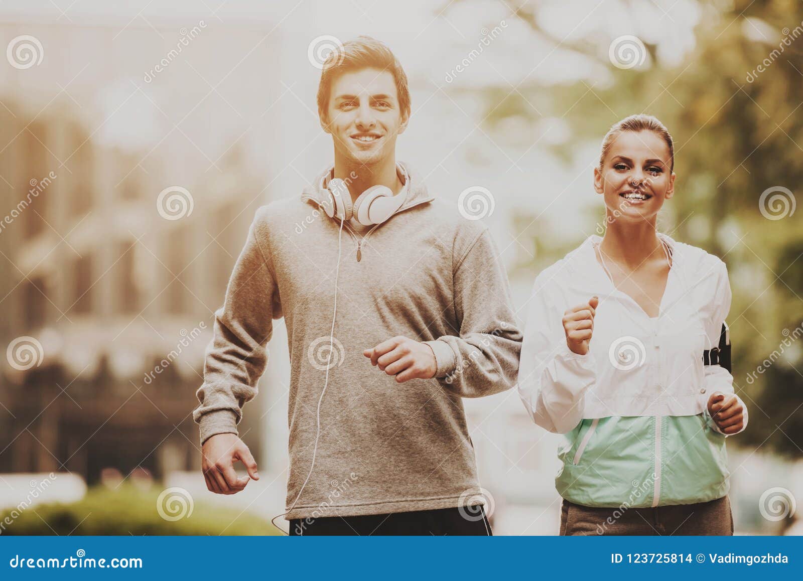 Young Happy Couple during Jogging in Morning. Stock Photo - Image of ...