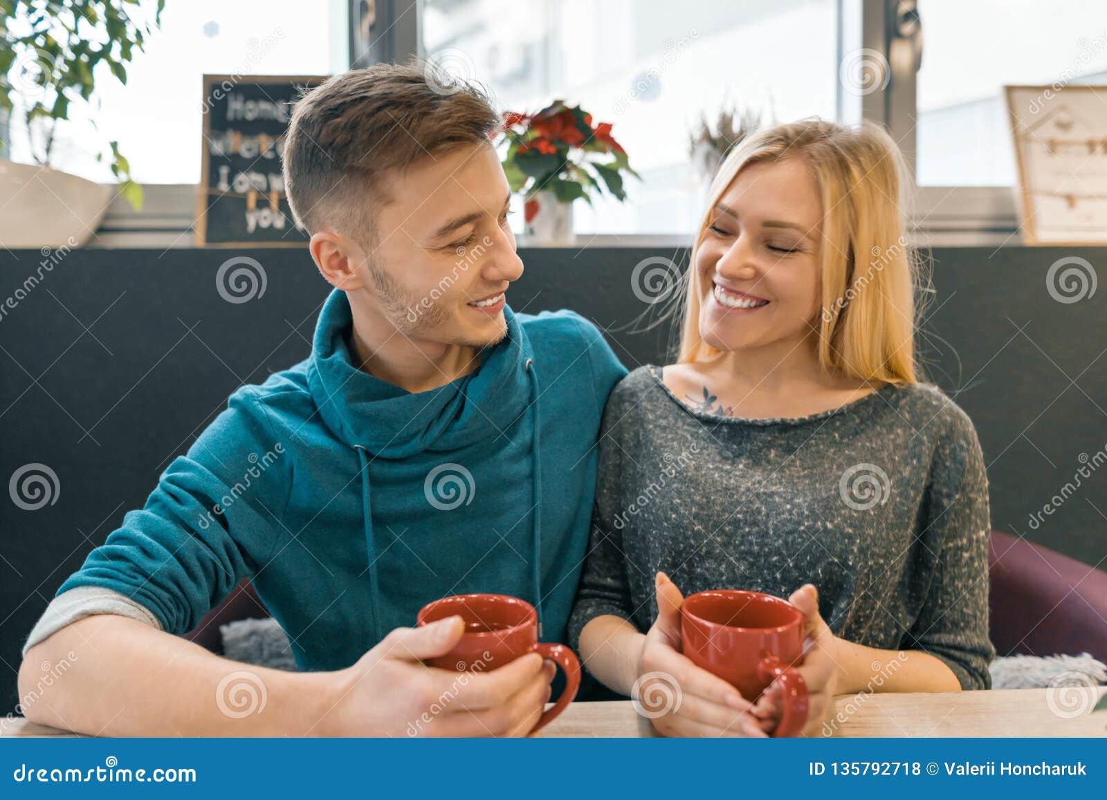 https://thumbs.dreamstime.com/z/young-happy-couple-love-cafe-man-woman-together-smile-hugging-drink-coffee-tea-135792718.jpg